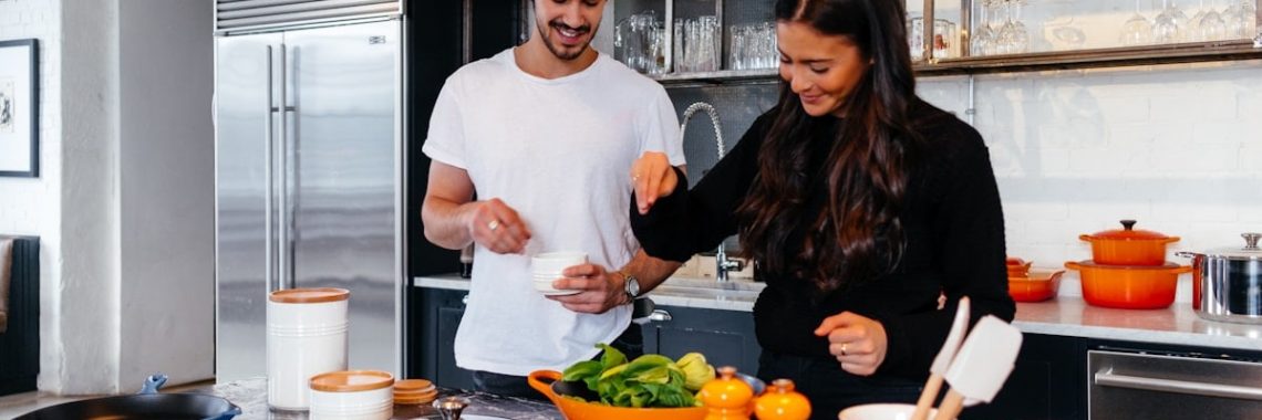 man and woman cooking
